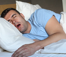 Man in light blue shirt snoring