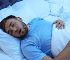 Man sleeping in a bed