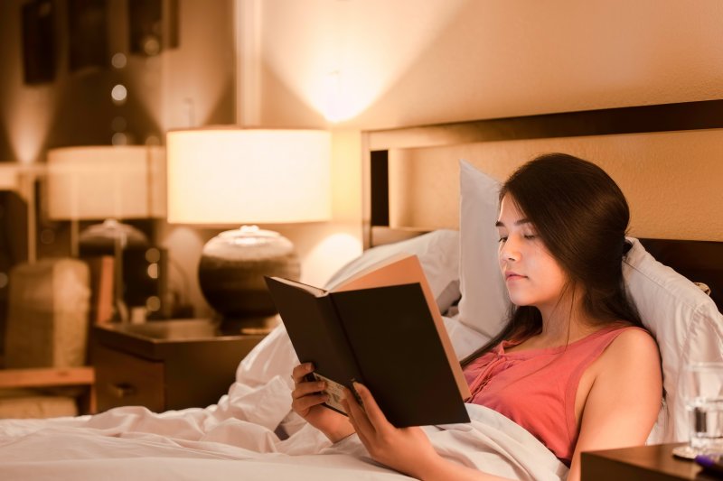 woman reading in bed