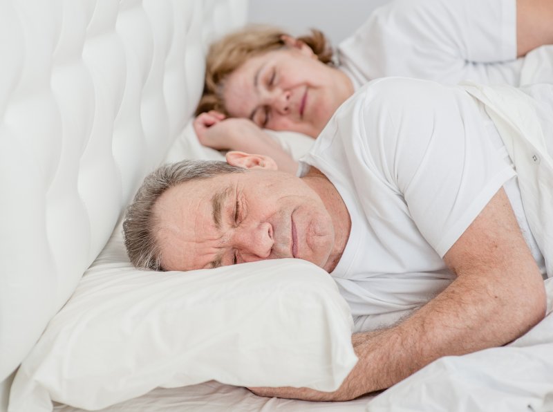 older couple sleeping peacefully 