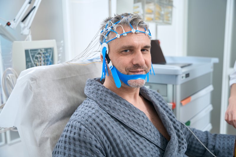 a patient smiling before a sleep test