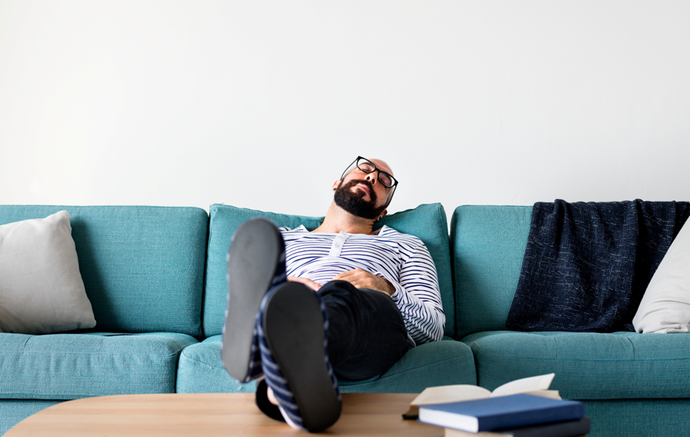 man napping on couch